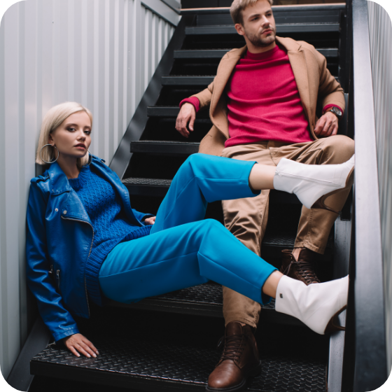 man and woman model sitting on stairs