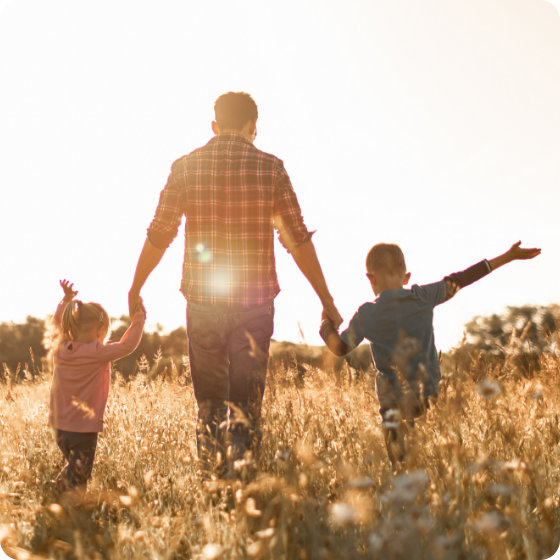 Family walking through field